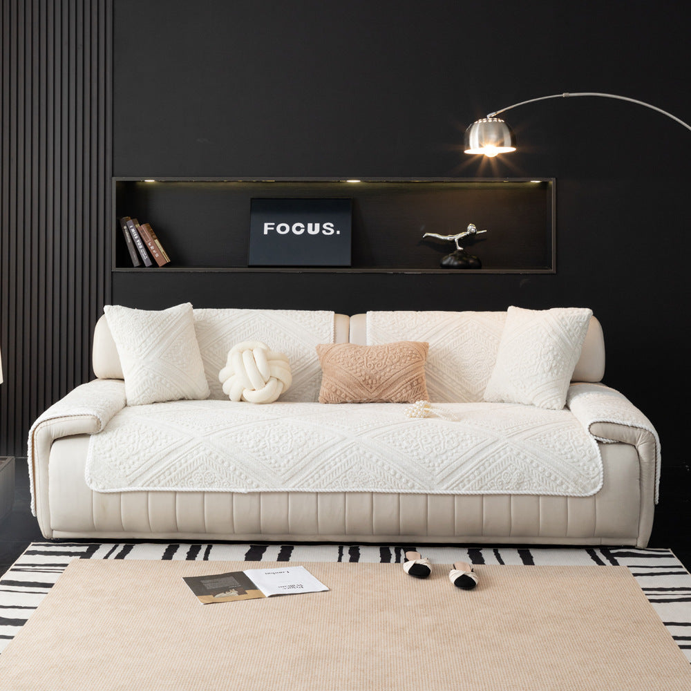 Detailed shot of the non-slip backing on a Nordic carved plush sofa protector
