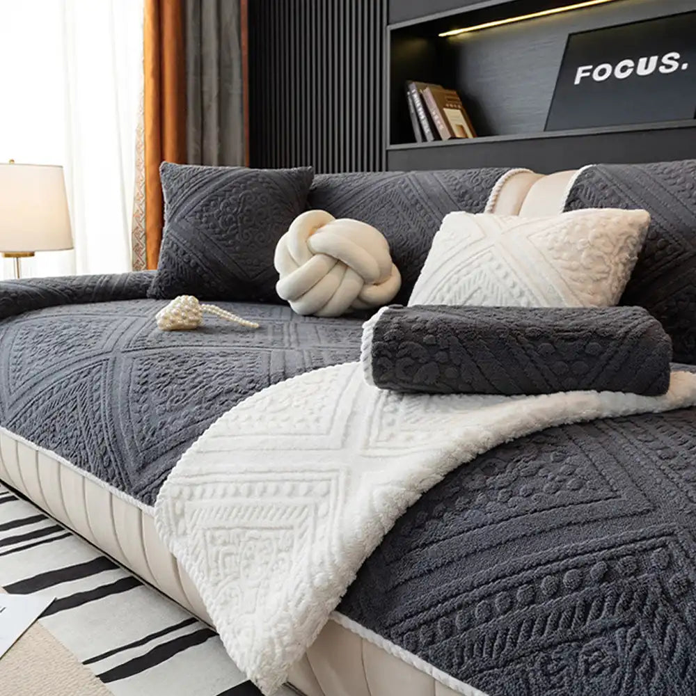 Carved pattern on a luxurious plush non-slip sofa cover, enhancing home decor