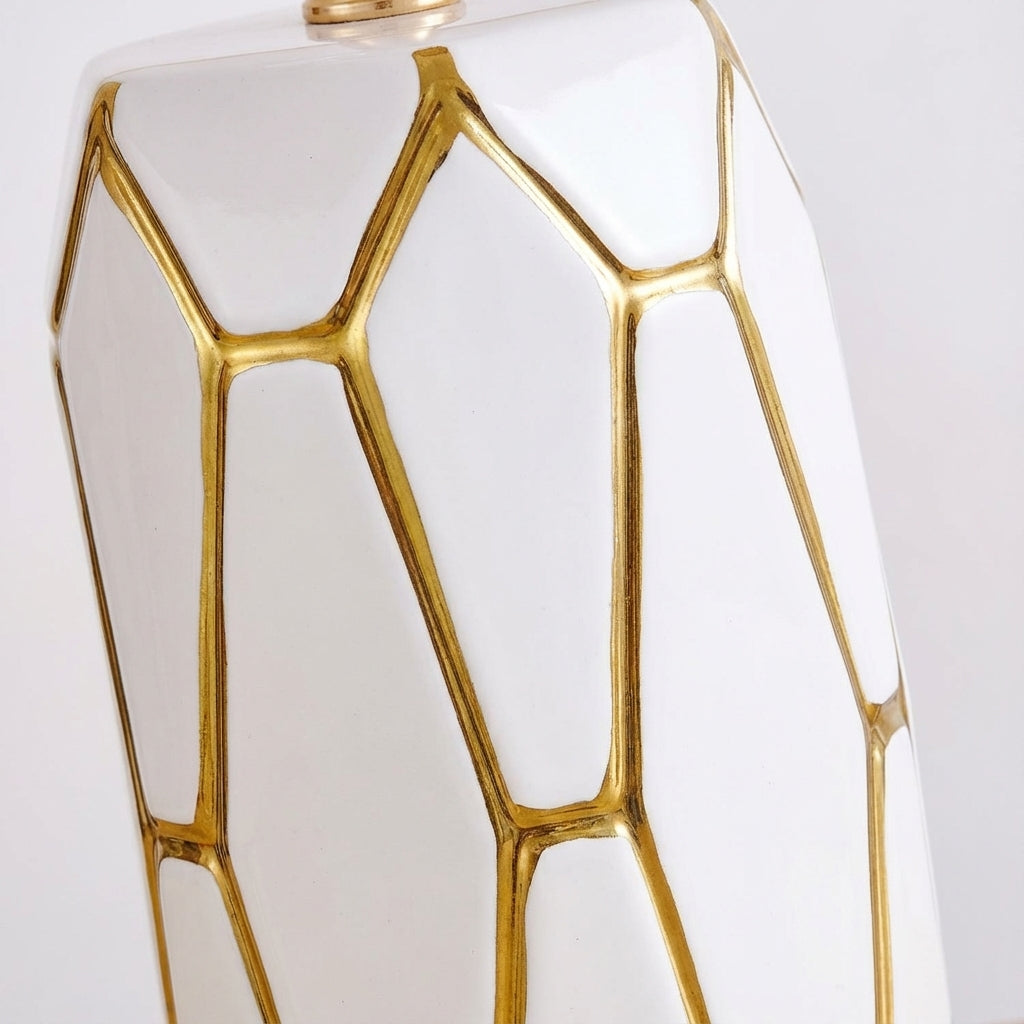 Stylish ceramic table lamp provides warm ambient lighting for bedroom nightstand, living room side table, or desk.