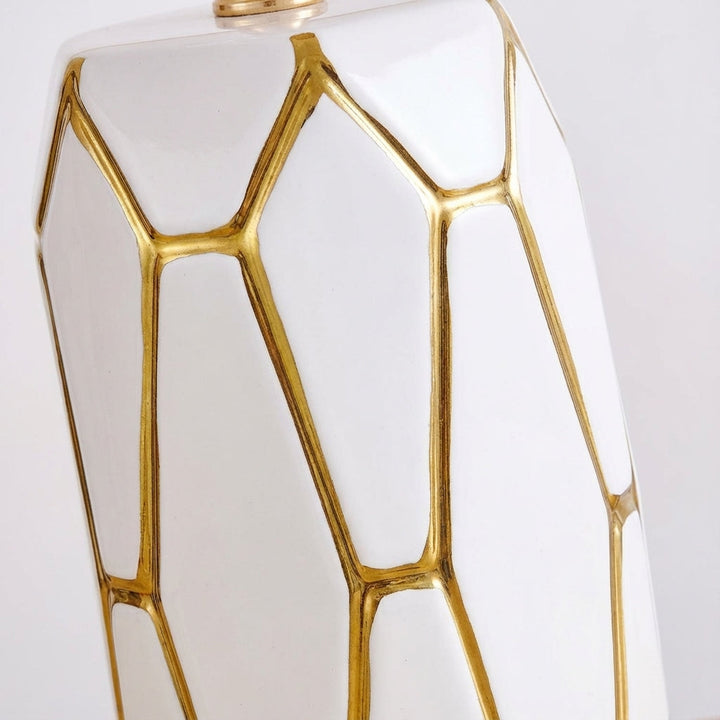 Stylish ceramic table lamp provides warm ambient lighting for bedroom nightstand, living room side table, or desk.
