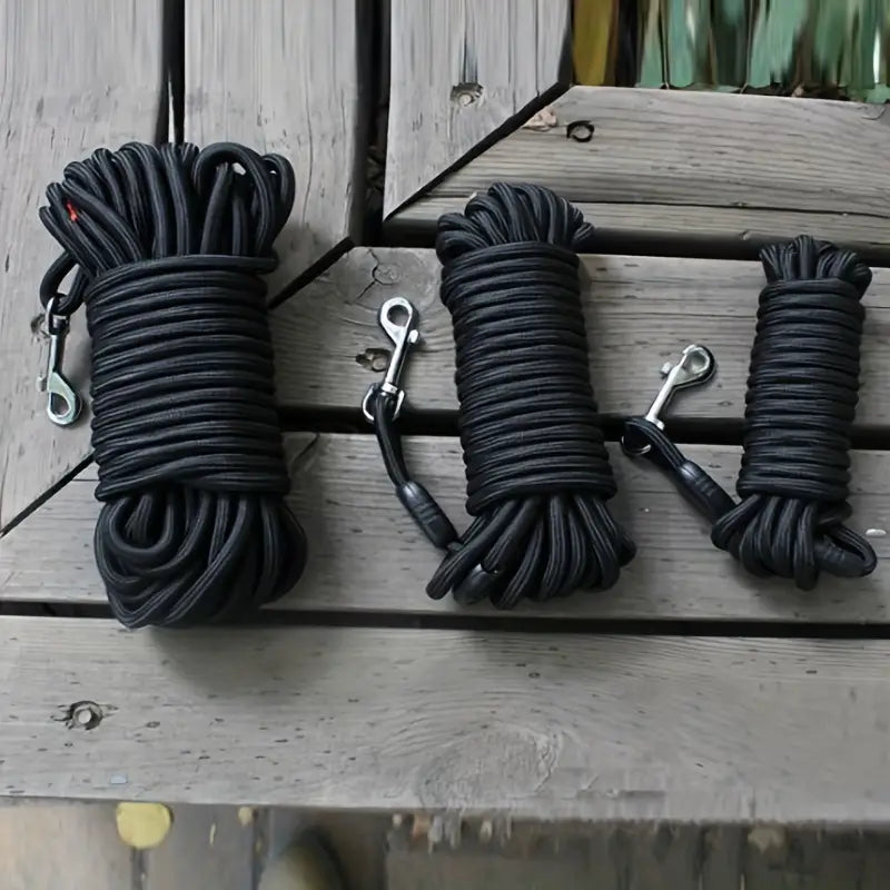Black nylon dog training leash, 15ft, with ergonomic handle for effective recall training.