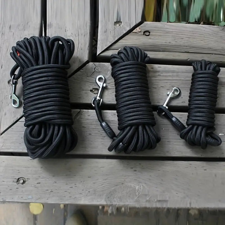 Black nylon dog training leash, 15ft, with ergonomic handle for effective recall training.