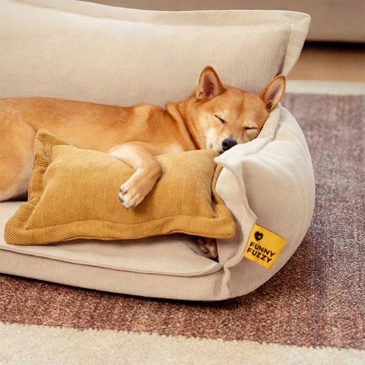 Orthopedic dog bed with a tan removable pillow, designed for pet comfort in all seasons.