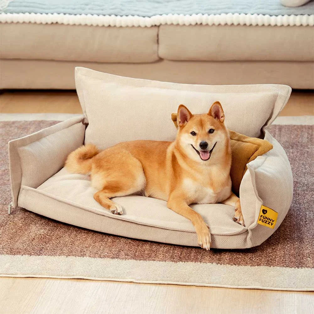 Orthopedic dog bed with a dark gray chenille cover and lighter removable pillow for pets.