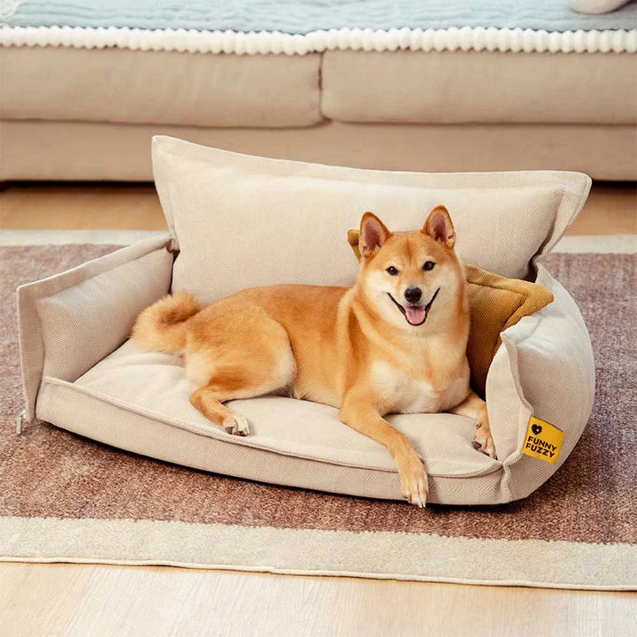 Orthopedic dog bed with a dark gray chenille cover and lighter removable pillow for pets.