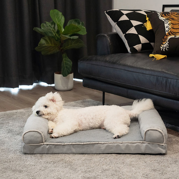 Plush orthopedic dog bed with full generous bolster for deep sleep comfort