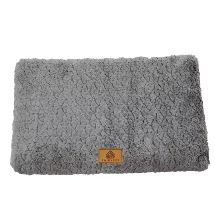 Washable orthopedic pet mat on a hardwood floor, soft and fluffy for dog or cat