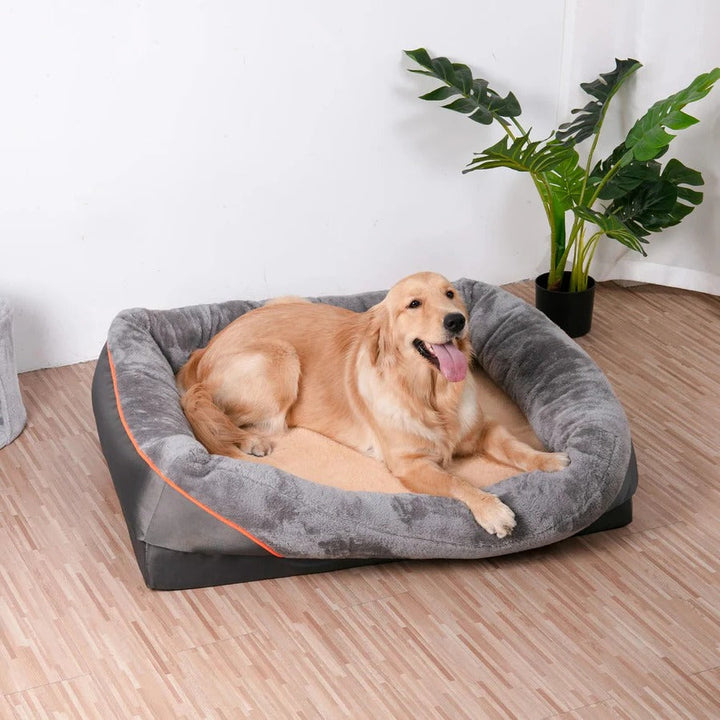 Orthopedic dog bed with raised sides and washable cover providing joint support for pet comfort.