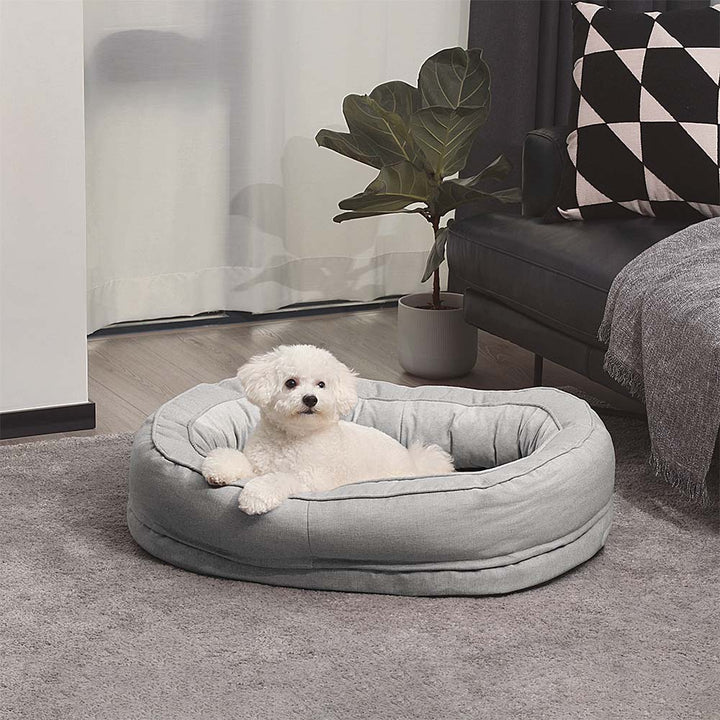 Grey orthopedic donut dog bed, a cozy pet bed for restful sleep.