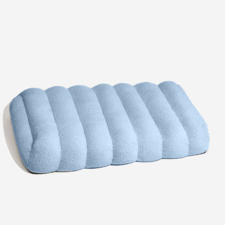 Corner detail of a washable creamy orthopedic flat dog bed, offering luxurious pet comfort