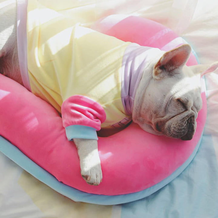 Beige orthopedic spine-support pet pillow, round macaron style dog bed for comfortable sleep.
