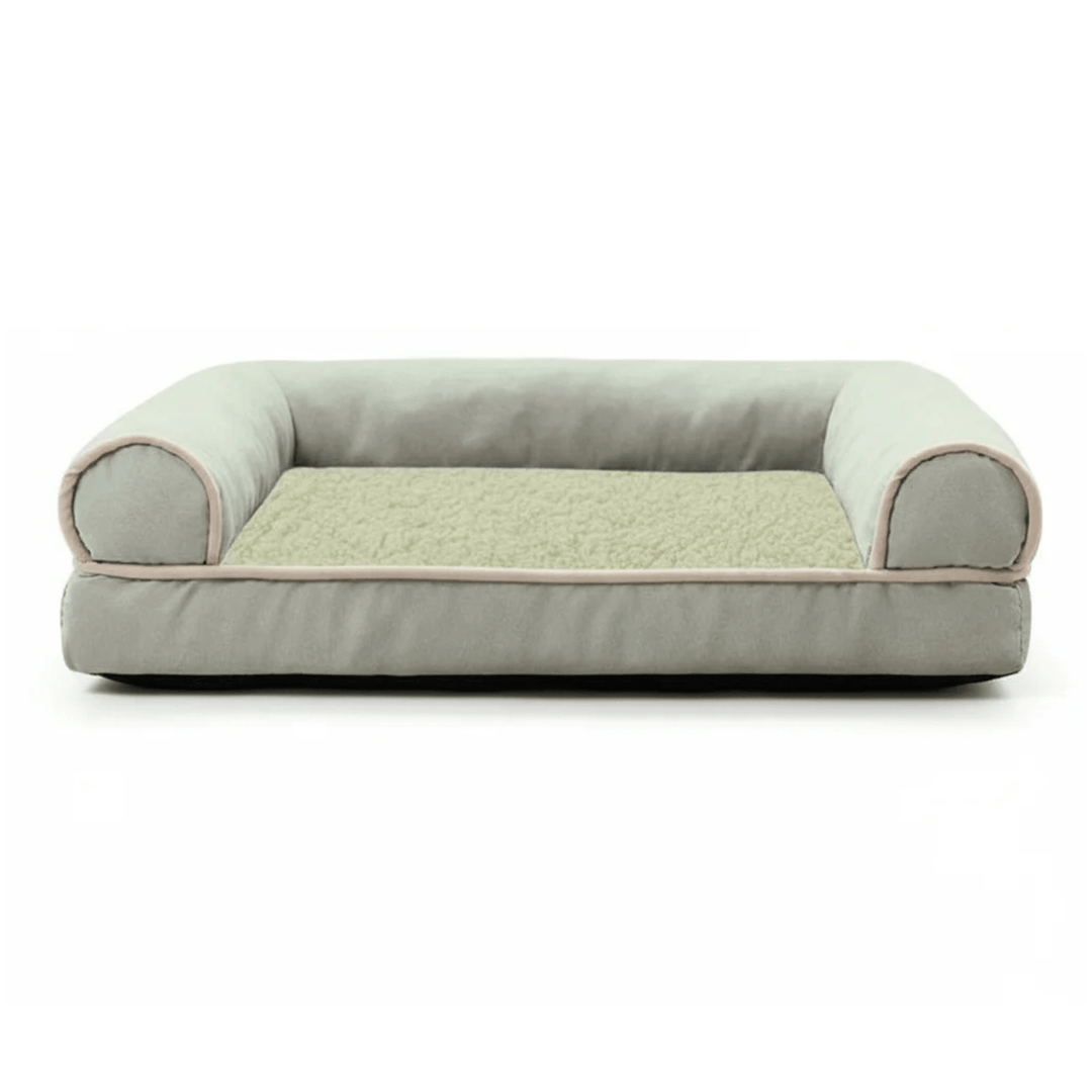 Memory foam cat bed with firm bolster, promoting deep sleep and orthopedic joint support for pets.