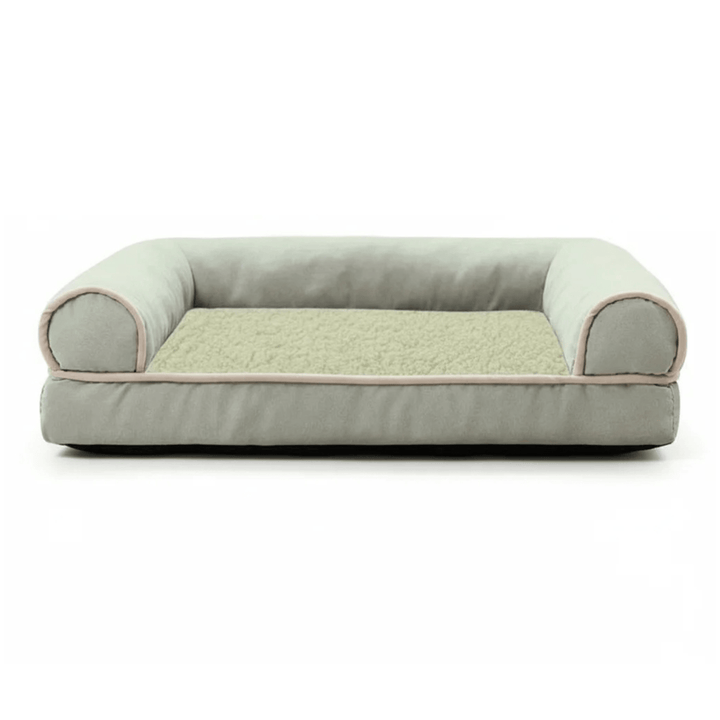 Memory foam cat bed with firm bolster, promoting deep sleep and orthopedic joint support for pets.