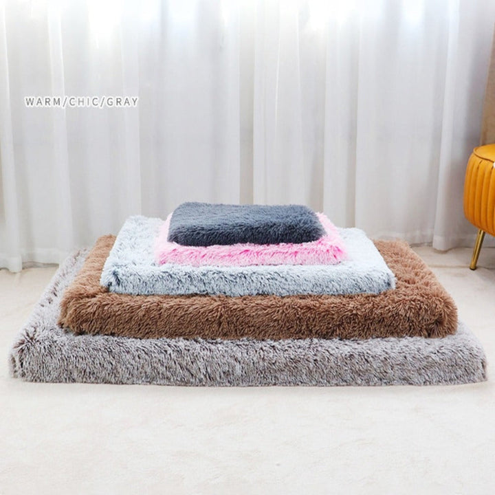 Calming dog mattress with orthopedic memory foam core and soft, washable fabric cover.