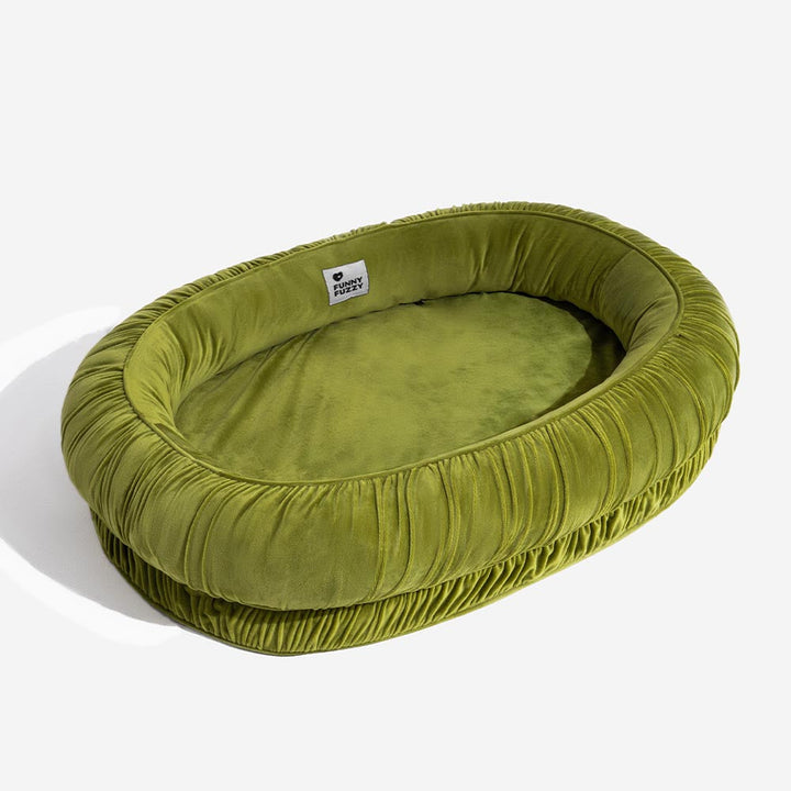 Machine washable orthopedic dog bed, oval, with a soft velvet finish and a convenient detachable cover.