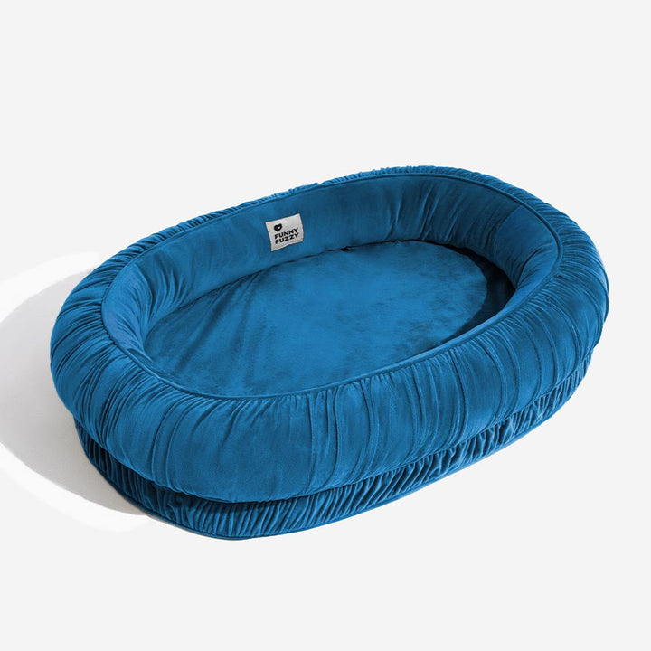 Orthopedic pet bed for small to large dogs, oval, with a premium velvet feel and detachable cover.