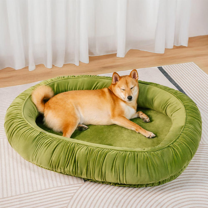 Velvet orthopedic pet bed for dogs and cats, oval, designed for calming with a detachable cover.