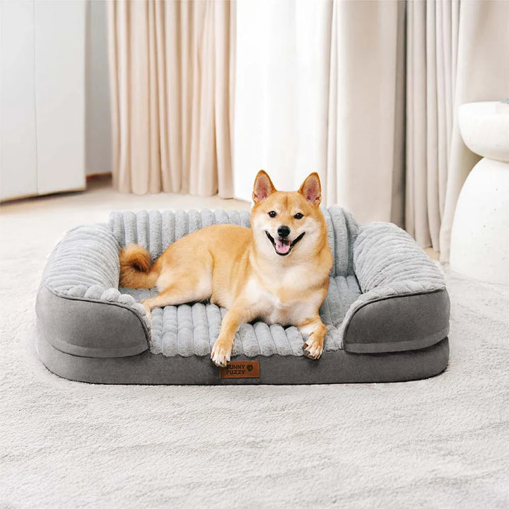 Soft washable orthopedic dog bed with bolster design, ideal for pet relaxation