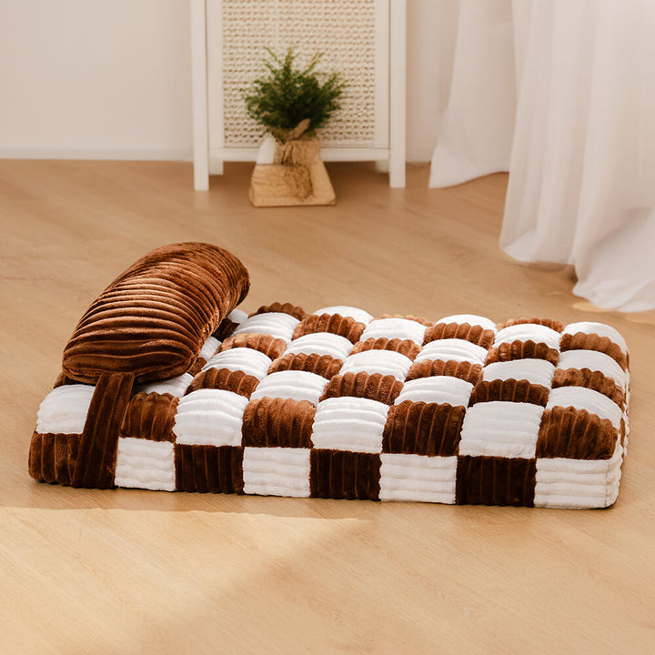 Pet comfort: orthopedic plush chessboard dog bed with a supportive pillow and non-slip base.