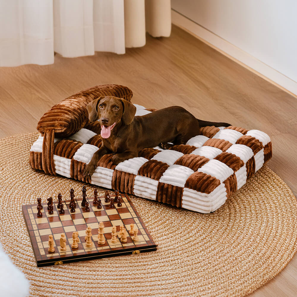 Close-up of a washable orthopedic dog bed, plush chessboard pattern, and cozy pillow.