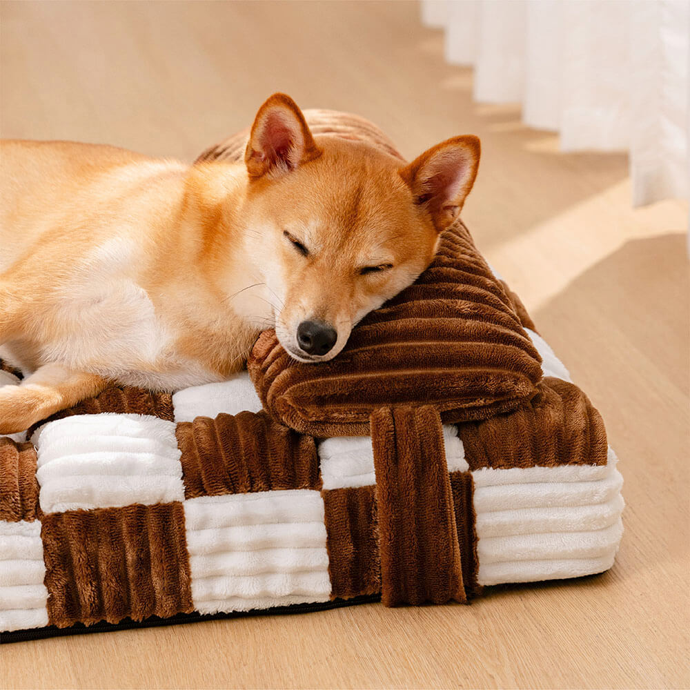 Non-slip orthopedic dog bed, plush chessboard print, designed for pet comfort and support.