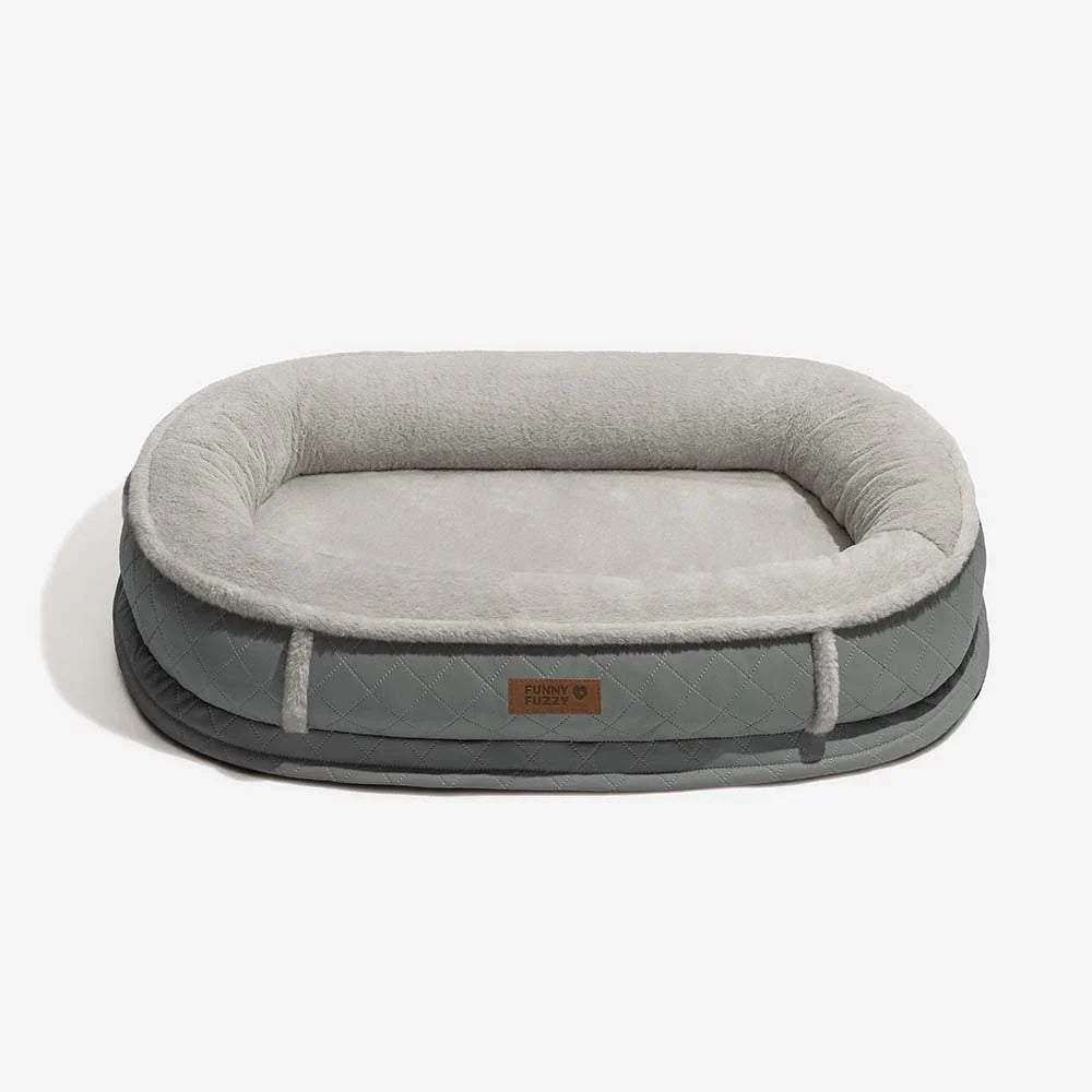 Orthopedic pet bed with a contrasting faux leather border, adding style to pet supplies