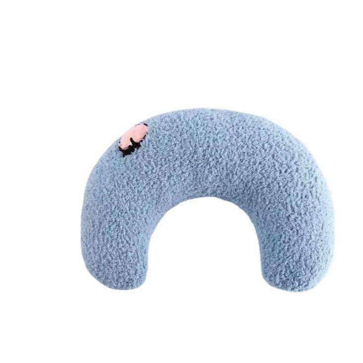 Close-up of the soft, durable fabric of an orthopedic U-shaped dog bed for relaxation.