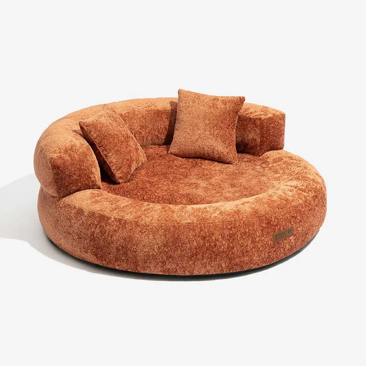 Side view of modern orthopedic donut dog bed, velvet fabric, and integrated supportive pillows.