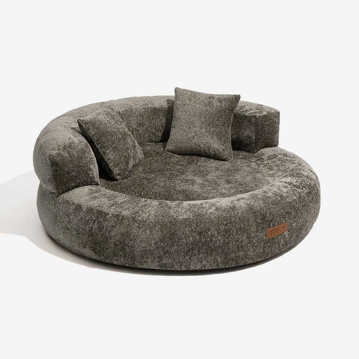 Brown velvet orthopedic donut dog bed with full pillow bolsters, promoting restful sleep.