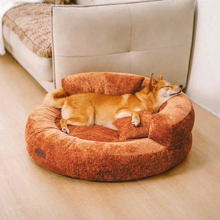 Luxurious velvet donut dog bed, orthopedic design, ideal for calming anxious dogs, washable cover.
