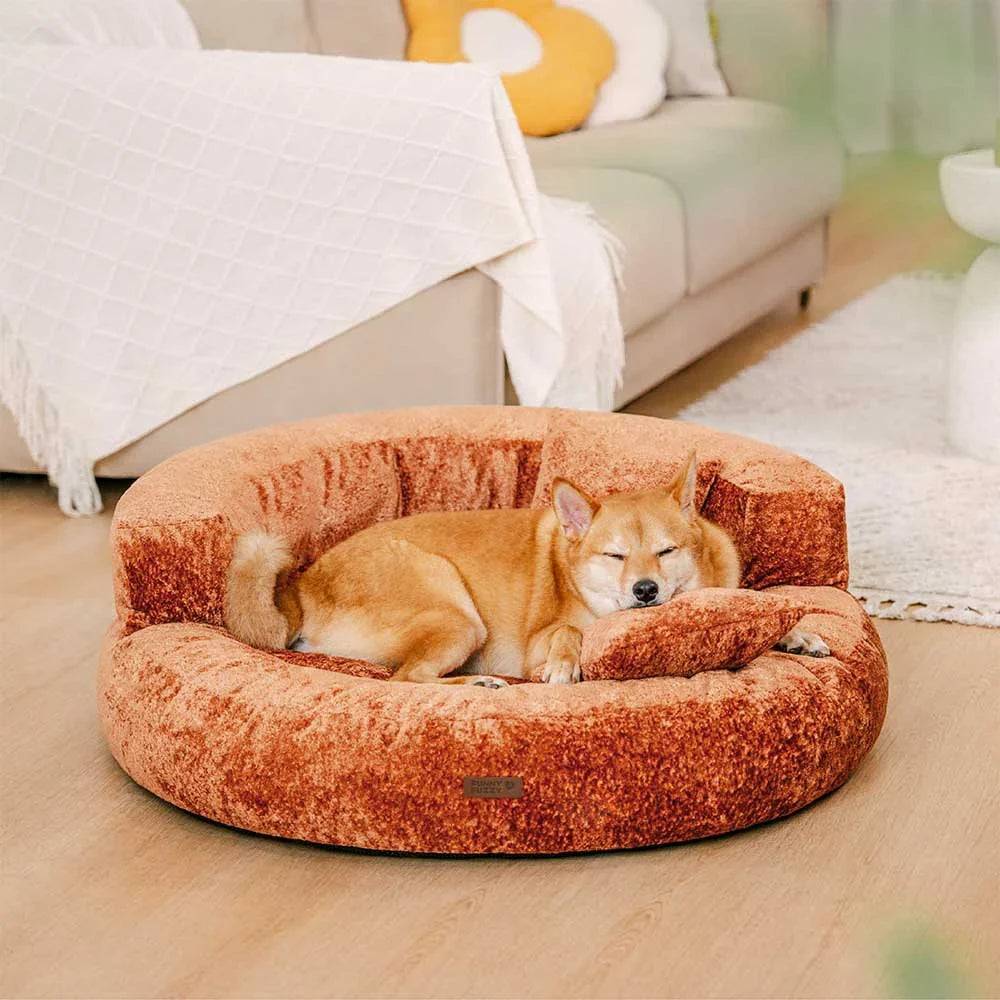 Comfortable orthopedic donut dog bed made of soft velvet, provides warmth and security for pets.