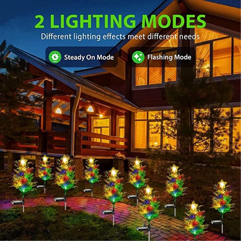 Waterproof solar cypress tree light casting a beautiful starry effect, excellent for garden and lawn decor.