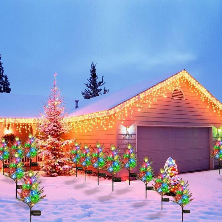 Outdoor LED solar cypress tree light with a dazzling starry glow, enhancing evening garden landscapes.
