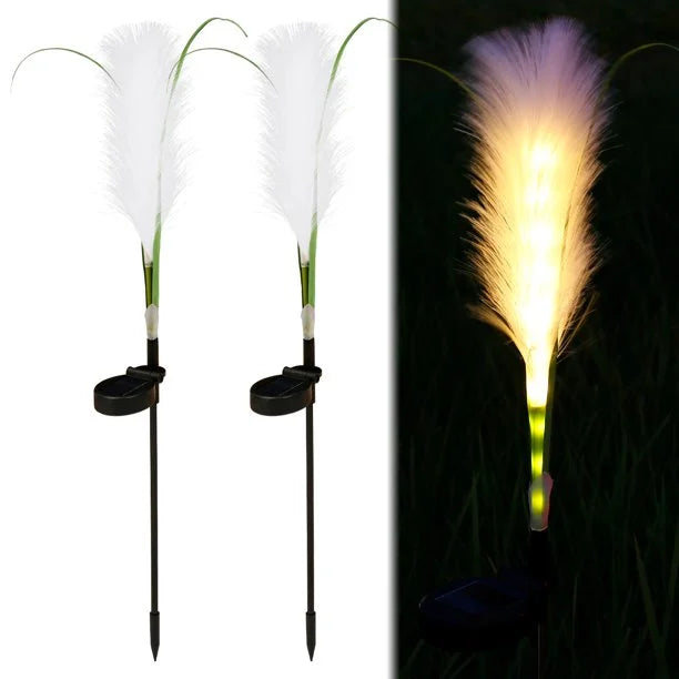 Natural-looking solar reed lights, blending seamlessly with garden landscapes and yard decor.