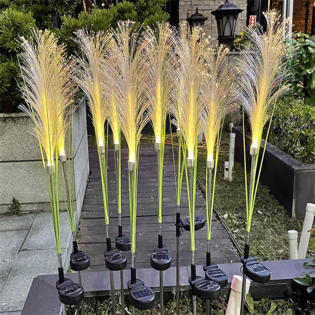 Close-up of the firework-effect LED on a solar reed garden light, vivid and bright.