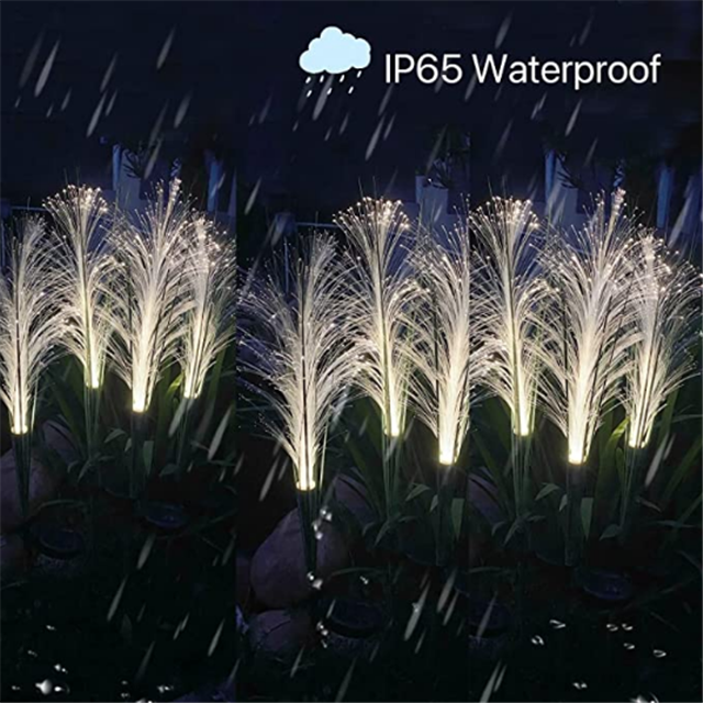 Outdoor solar powered firework reed light, adding sparkling garden decor to pathways.