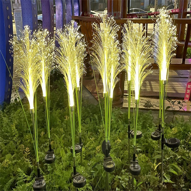 Solar reed garden light with a built-in panel, durable and ideal for outdoor lawn decor.