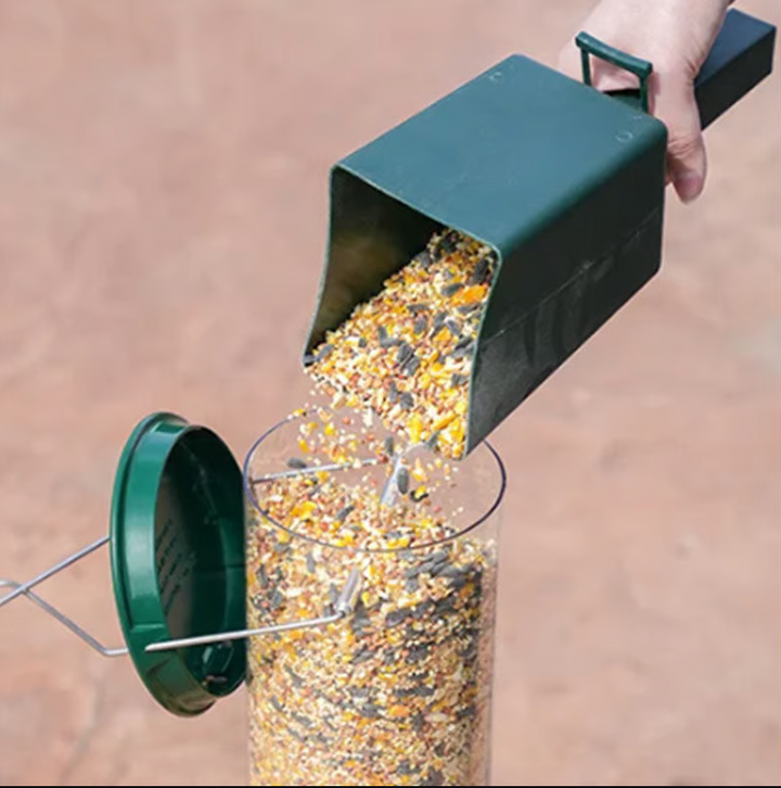 Close-up of squirrel-proof bird feeder, showing seed ports and robust wire cage, outdoor pet supplies