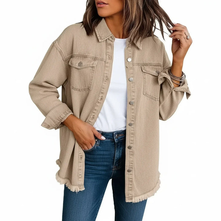 Women's oversized shirt jacket with fringe hem for stylish layering. Relaxed fit button-down outerwear.