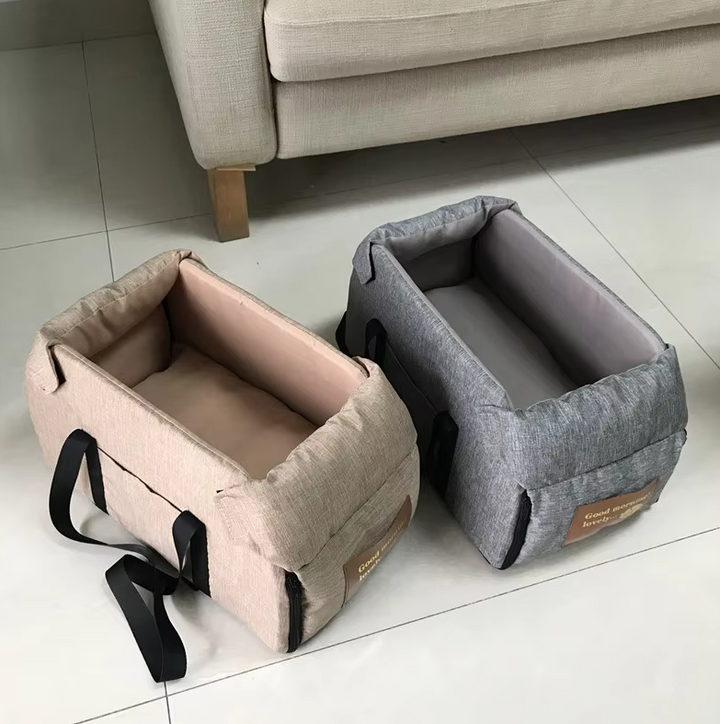 Portable pet travel seat for cars, featuring soft padding and secure attachments.