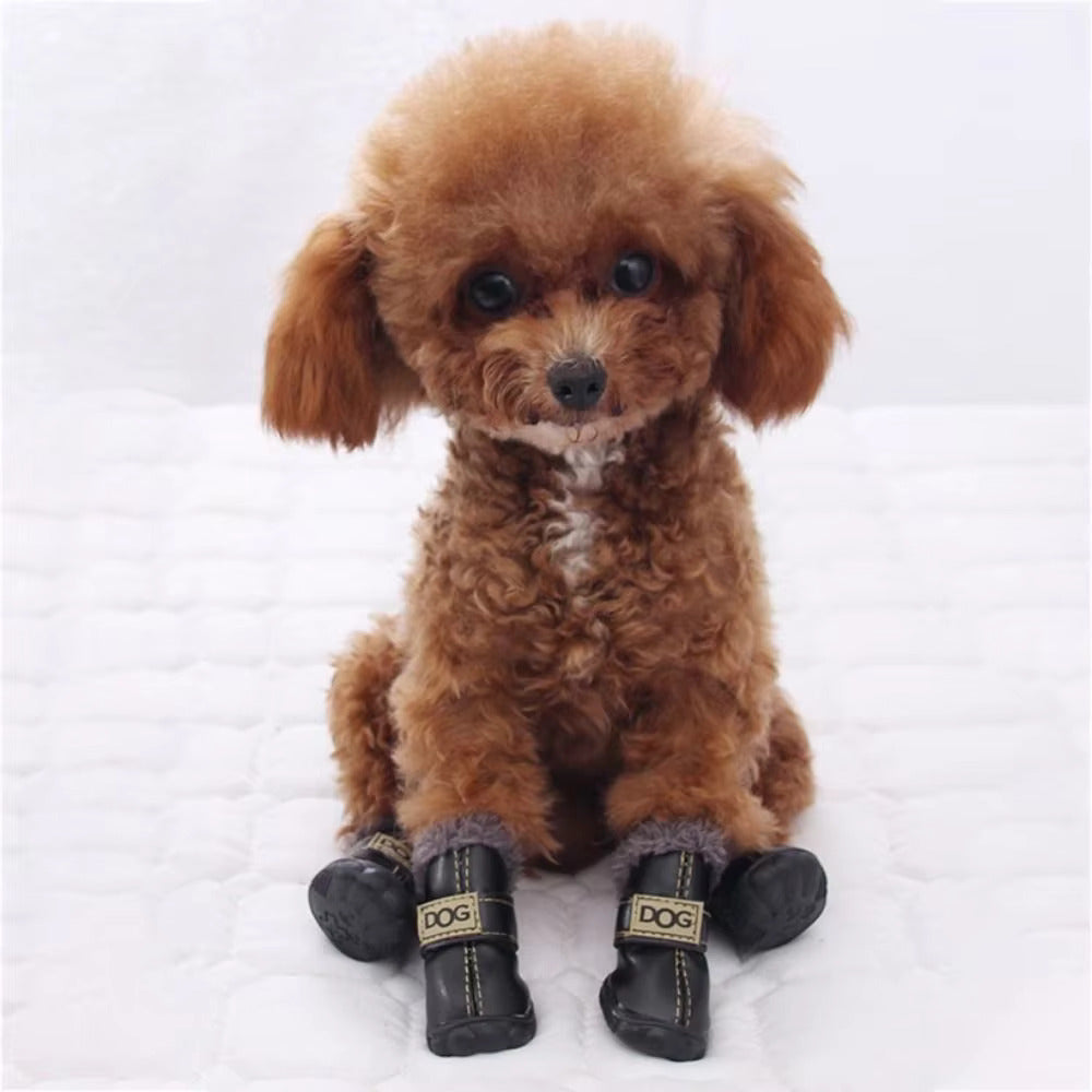 Pair of black waterproof dog snow boots with paw protection for winter
