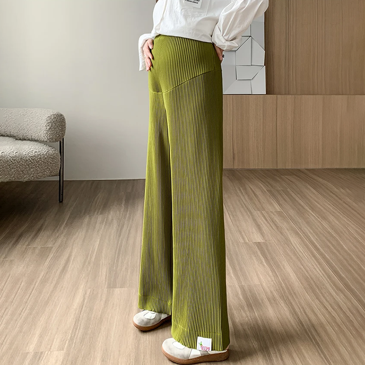 Close-up of soft, stretchy ribbed fabric on women's maternity pants, ensuring ultimate comfort.