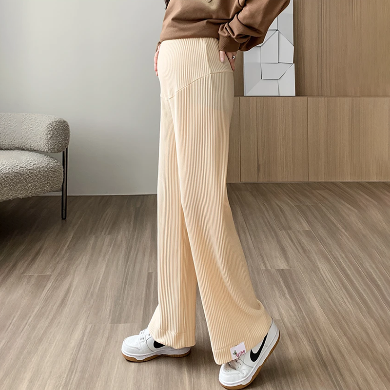 Flattering high-waist ribbed maternity pants, with a wide-leg design for comfortable wear during pregnancy.