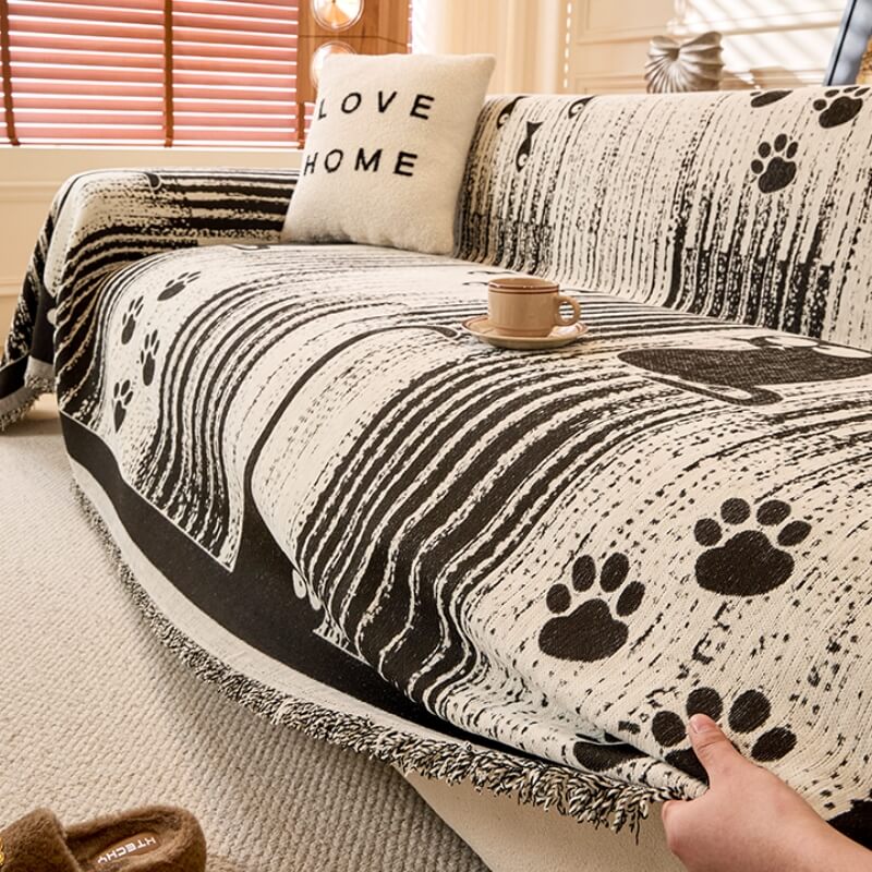Paw Print Chenille Anti-Scratch pet sofa throw in gray, protecting furniture from scratches.