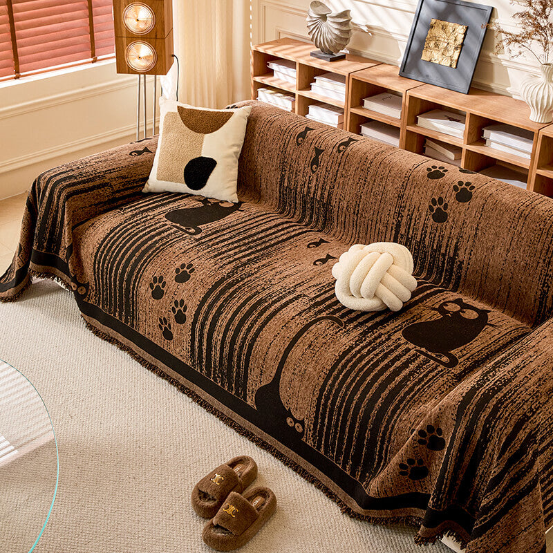 Textured chenille sofa throw with paw print design, a pet-friendly and anti-scratch solution.