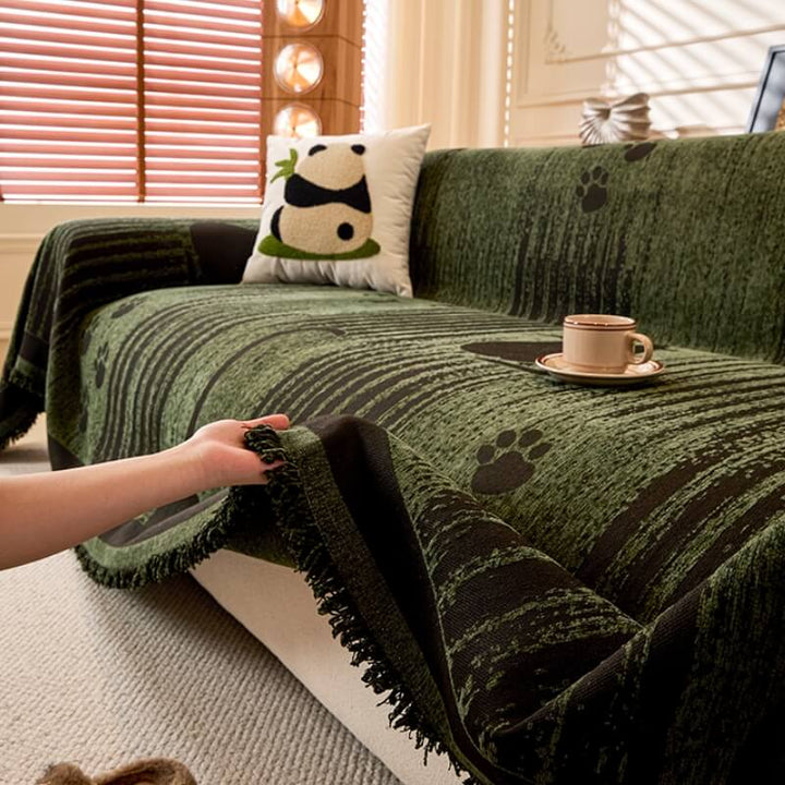Close-up of chenille fabric with embossed paw prints on an anti-scratch couch throw.