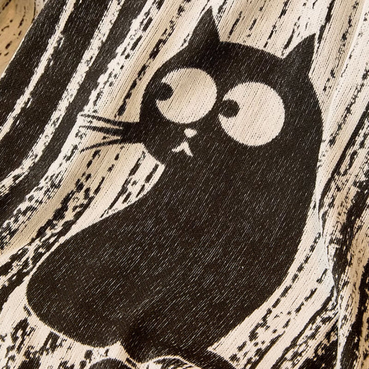 Dark gray chenille anti-scratch sofa throw with subtle paw print pattern for pet owners.