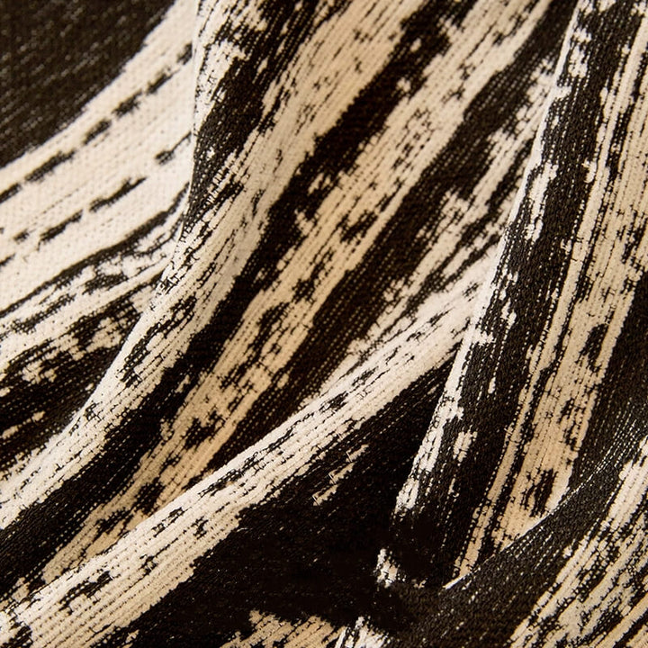 Paw Print Chenille pet-friendly couch cover in a living room, enhancing home decor.