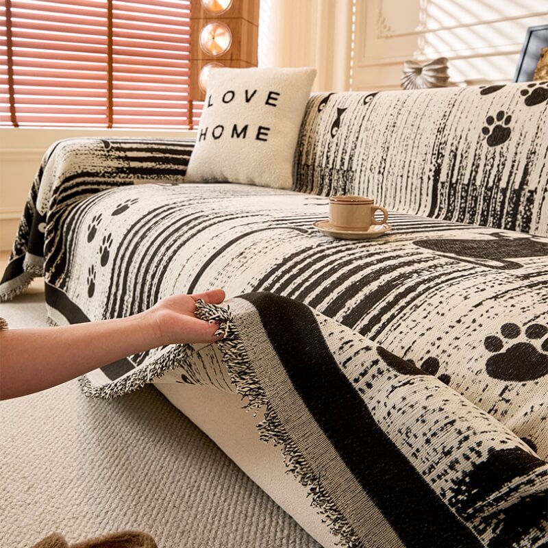 Anti-scratch chenille sofa throw featuring a paw print motif, ideal for pet protection.
