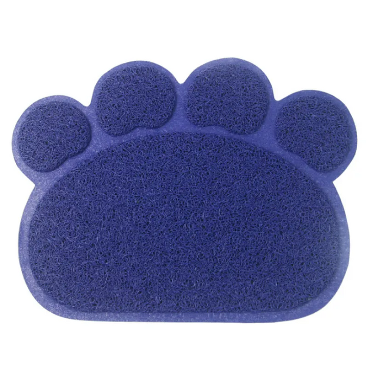 Close-up of a black paw-shaped litter mat, showcasing its textured surface for effective litter trapping.